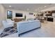 Open-concept living room with modern furnishings that leads into the dining area and kitchen at 794 Willits St, Las Vegas, NV 89138