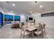 Open-concept living space with pool access, dining area, and modern furnishings at 794 Willits St, Las Vegas, NV 89138