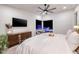 Serene main bedroom featuring a plush bed, a cozy seating area, and views of the pool at 794 Willits St, Las Vegas, NV 89138