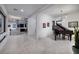 Elegant open floor plan showcasing a modern kitchen with granite countertops and a spacious living area with a piano at 794 Willits St, Las Vegas, NV 89138