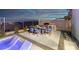 Outdoor kitchen featuring a built-in grill, dining area, and mountain views at 794 Willits St, Las Vegas, NV 89138