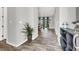 Modern entryway with a view of the dining room and hardwood floors throughout at 8245 Broad Branch Way, Las Vegas, NV 89113