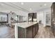 An open floorplan view of a kitchen island, living room, and access to the pantry at 8245 Broad Branch Way, Las Vegas, NV 89113