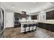 Beautiful open concept kitchen with an island, stainless steel appliances, and hardwood floors at 8245 Broad Branch Way, Las Vegas, NV 89113