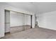 Spacious carpeted bedroom with large mirrored closet and ensuite access offers comfort and convenience at 8410 Eldora Ave # 2045, Las Vegas, NV 89117