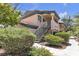 Exterior view of a multi-Gathering residential building featuring lush landscaping and stairwell at 8410 Eldora Ave # 2045, Las Vegas, NV 89117