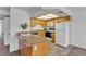 Bright kitchen featuring laminate countertops, light wood cabinets, and white appliances at 8410 Eldora Ave # 2045, Las Vegas, NV 89117