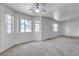 Spacious living room with natural light featuring neutral carpet, and multiple windows at 8410 Eldora Ave # 2045, Las Vegas, NV 89117