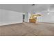 Spacious open-concept living space showing the transition from the living room to the kitchen at 8410 Eldora Ave # 2045, Las Vegas, NV 89117