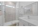Modern bathroom featuring frameless shower, white vanity, and stylish fixtures at 12438 Heritage Bend Dr, Las Vegas, NV 89138