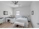 Bright bedroom with a white bed, desk, and stylish decor, creating a serene space at 12438 Heritage Bend Dr, Las Vegas, NV 89138