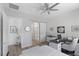 Bedroom with natural light, plank wall, desk, and ensuite bathroom with a sliding barn door at 12438 Heritage Bend Dr, Las Vegas, NV 89138