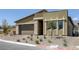 Charming single-story home with a two-car garage and desert landscaping for low maintenance at 12438 Heritage Bend Dr, Las Vegas, NV 89138