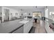 Open-concept kitchen featuring a large island, modern countertops, and an adjacent living area at 12438 Heritage Bend Dr, Las Vegas, NV 89138