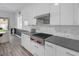 Stylish kitchen with sleek white cabinets, modern countertops, and stainless steel appliances at 12438 Heritage Bend Dr, Las Vegas, NV 89138