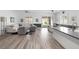Bright living room featuring a large sofa, modern furnishings, and sliding glass doors to the backyard at 12438 Heritage Bend Dr, Las Vegas, NV 89138