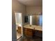 Bright bathroom features a white vanity, large mirror, and good lighting at 2541 Love St, Las Vegas, NV 89121