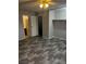 Bedroom showcasing plank flooring with an open closet and access to other rooms at 2541 Love St, Las Vegas, NV 89121