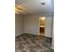 Bedroom showing plank flooring and a light wall color, plus an adjacent bathroom at 2541 Love St, Las Vegas, NV 89121