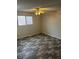 Bedroom with modern flooring and ceiling fan, providing comfort and style at 2541 Love St, Las Vegas, NV 89121