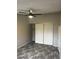 Bedroom with modern flooring, ceiling fan, and closet for ample storage at 2541 Love St, Las Vegas, NV 89121