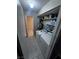 Efficient laundry area with washer, dryer, shelving, and easy access to adjacent space at 2541 Love St, Las Vegas, NV 89121