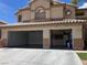 Two-car garage with ample storage space and organized shelving, offering convenience and functionality at 277 Grand Olympia Dr, Henderson, NV 89012