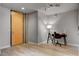 Bedroom with sleek furnishings, neutral walls, wood-look floors, and ample natural light from large windows at 353 E Bonneville Ave # 754, Las Vegas, NV 89101