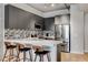 Modern kitchen features a breakfast bar, stainless steel appliances, sleek countertops, and stylish backsplash at 353 E Bonneville Ave # 754, Las Vegas, NV 89101