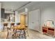 Open floor plan showcasing the kitchen with breakfast bar and a dining area featuring modern decor at 353 E Bonneville Ave # 754, Las Vegas, NV 89101