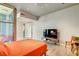 Bright main bedroom with wood floors, a modern bed frame, a glass door to a terrace, and a minimalist aesthetic at 353 E Bonneville Ave # 754, Las Vegas, NV 89101