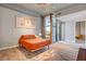 Bright and modern main bedroom featuring wood floors, a terrace, and minimalist decor at 353 E Bonneville Ave # 754, Las Vegas, NV 89101