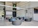 Outdoor lounge area with comfortable seating, modern decor, and concrete walls at 353 E Bonneville Ave # 754, Las Vegas, NV 89101