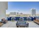Enjoy the city views from this rooftop deck featuring lounge seating and tables at 353 E Bonneville Ave # 754, Las Vegas, NV 89101
