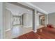 Open foyer with tiled flooring, decorative columns and a double door entrance at 496 Grassrange Ln, Henderson, NV 89052