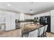Features an open concept kitchen with granite counters, stainless steel appliances, and a large island with seating at 496 Grassrange Ln, Henderson, NV 89052