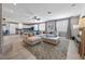 Open-concept living room features tile floors, a fireplace, and backyard access at 496 Grassrange Ln, Henderson, NV 89052
