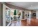 Bright open floor plan with hardwood flooring, showcases a seamless indoor/outdoor connection to the pool and patio at 496 Grassrange Ln, Henderson, NV 89052