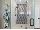 Modern walk-in shower features sleek design and a built-in bench at 496 Grassrange Ln, Henderson, NV 89052