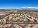 Stunning aerial view showcases the community's layout and proximity to city and mountain views at 50 E Serene Ave # 107, Las Vegas, NV 89123