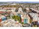 Aerial view of colorful condo buildings with landscaped grounds, located in Las Vegas, NV with city and mountain views at 50 E Serene Ave # 107, Las Vegas, NV 89123