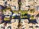 Aerial view showcases the layout of buildings, green spaces, and amenities within this vibrant condo community at 50 E Serene Ave # 107, Las Vegas, NV 89123