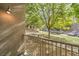 Apartment balcony with views of greenery and the parking area at 50 E Serene Ave # 107, Las Vegas, NV 89123