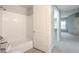 Bathroom features a shower-tub combination, and a door leading out to the hall at 50 E Serene Ave # 107, Las Vegas, NV 89123