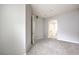 Carpeted bedroom features a view of the ensuite bathroom through an open doorway at 50 E Serene Ave # 107, Las Vegas, NV 89123