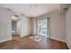 Inviting bedroom features hardwood floors and sliding door access to a balcony at 50 E Serene Ave # 107, Las Vegas, NV 89123