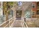 Inviting building entrance with stone facade and well-maintained landscaping at 50 E Serene Ave # 107, Las Vegas, NV 89123
