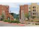 Manhattan Condominiums featuring well-maintained landscaping, colorful exteriors, and a welcoming entrance for residents and visitors at 50 E Serene Ave # 107, Las Vegas, NV 89123