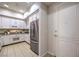 Well-equipped kitchen with white cabinets, granite counters and stainless steel appliances at 50 E Serene Ave # 107, Las Vegas, NV 89123
