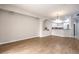 Spacious living room featuring hardwood floors and open layout into the kitchen at 50 E Serene Ave # 107, Las Vegas, NV 89123